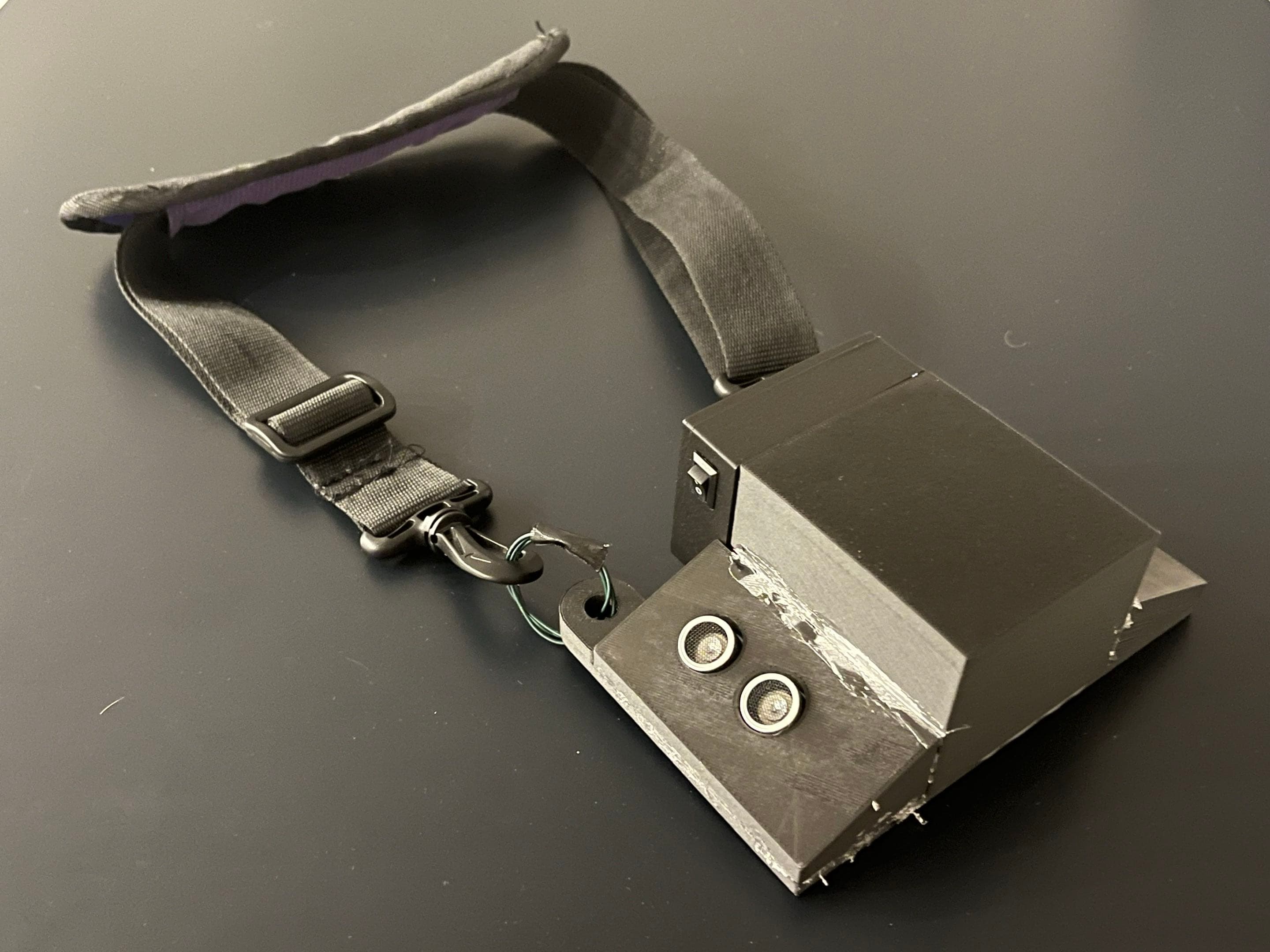 Wearable obstacle detector prototype with shoulder strap and two front-facing distance sensors